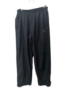 Nike track pants, typically featuring a solid blue color mens size M